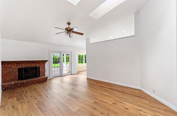 Empty room, Fireplace, Interior, Recessed Lighting, Stone Walls, Wood Texture Flooring