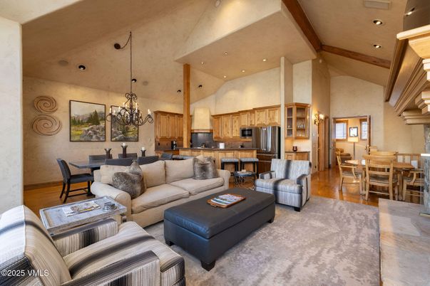 Chandelier, Dining room, Interior, Kitchen, Living room, Pendant Lights, Recessed Lighting, Stainless Steel Appliances, Wooden Beams, Wood Texture Flooring