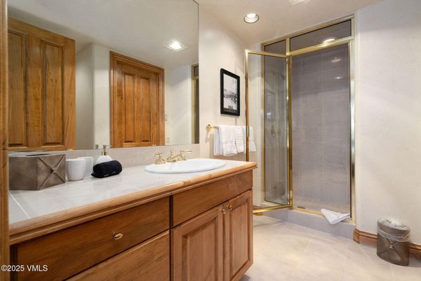 Bathroom, Dual Sink Vanities, Glass Shower, Interior, Recessed Lighting, Tile Countertops
