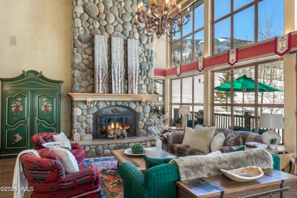 Chandelier, Fireplace, Interior, Living room, Stone Walls