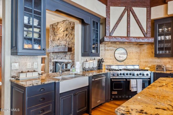 Fireplace, Interior, Kitchen, Stainless Steel Appliances, Stone Walls, Wood Texture Flooring