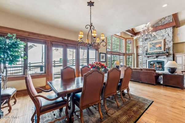 Chandelier, Dining room, Fireplace, Interior, Living room, Recessed Lighting, Wood Texture Flooring