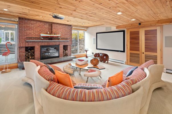 Fireplace, Interior, Living room, Projection Screen, Recessed Lighting, Stone Walls, Wooden Ceilings
