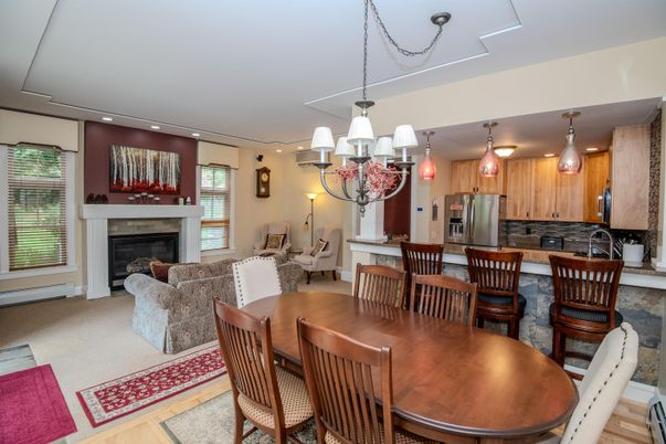 Chandelier, Dining room, Fireplace, Interior, Kitchen, Living room, Pendant Lights, Recessed Lighting, Stainless Steel Appliances