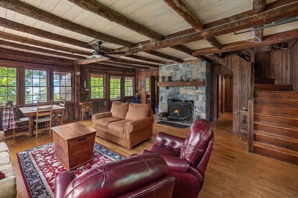 Dining room, Fireplace, Interior, Living room, Stone Walls, Wooden Beams, Wood Texture Flooring