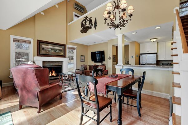 Chandelier, Dining room, Fireplace, Interior, Kitchen, Living room, Recessed Lighting, Stainless Steel Appliances, Wood Texture Flooring