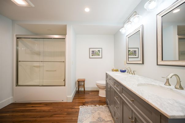 Bathroom, Dual Sink Vanities, Glass Shower, Interior, Recessed Lighting, Wood Texture Flooring