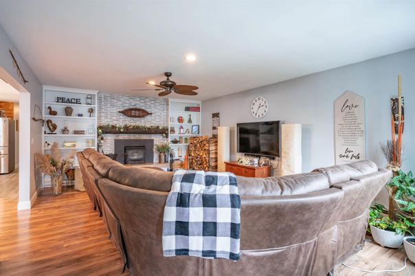 Fireplace, Interior, Living room, Recessed Lighting, Stone Walls, Wood Texture Flooring