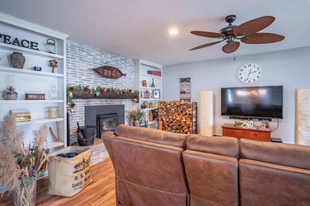 Fireplace, Interior, Living room, Recessed Lighting, Stone Walls, Wood Texture Flooring