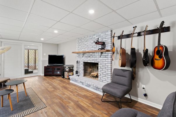 Fireplace, Interior, Piano, Recessed Lighting, Stone Walls, Wood Texture Flooring