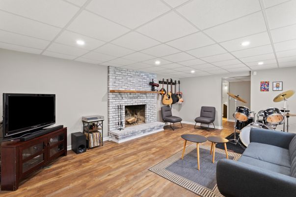 Fireplace, Interior, Living room, Recessed Lighting, Stone Walls, Wood Texture Flooring