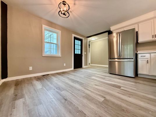 Empty room, Interior, Kitchen, Pendant Lights, Stainless Steel Appliances, Wood Texture Flooring