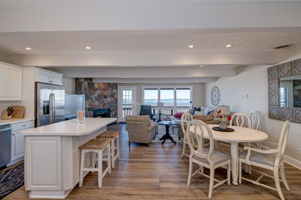Dining room, Fireplace, Interior, Kitchen, Living room, Recessed Lighting, Stainless Steel Appliances, Wood Texture Flooring