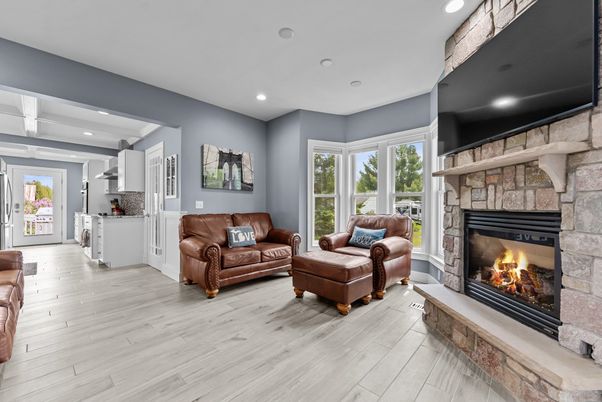 Fireplace, Interior, Living room, Recessed Lighting, Stone Walls, Wood Texture Flooring