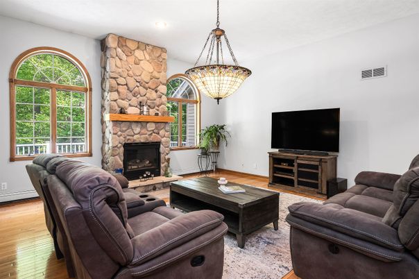 Fireplace, Interior, Living room, Pendant Lights, Recessed Lighting, Stone Walls, Wood Texture Flooring