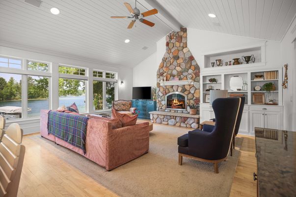 Fireplace, Home Office, Interior, Living room, Recessed Lighting, Stone Walls, Water, Wood Texture Flooring