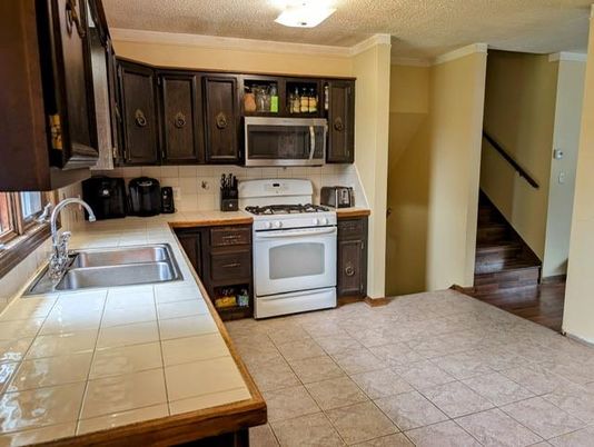 Interior, Kitchen, Tile Countertops, Wood Texture Flooring