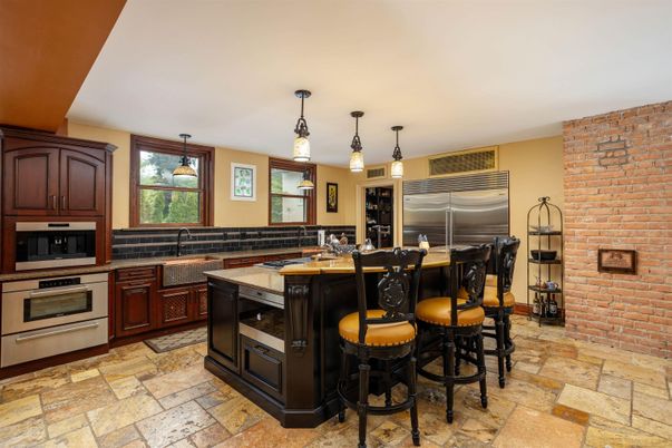 Interior, Kitchen, Pendant Lights, Stainless Steel Appliances, Stone Walls