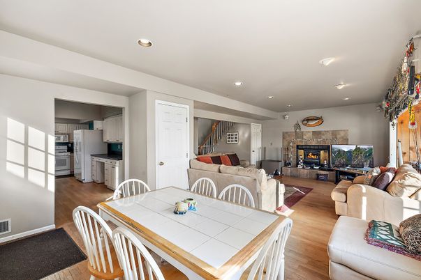 Dining room, Fireplace, Interior, Kitchen, Living room, Recessed Lighting, Wood Texture Flooring