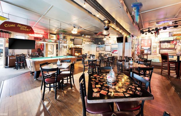 Billiard Table, Dining room, Fireplace, Game Room, Interior, Pendant Lights, Wood Texture Flooring