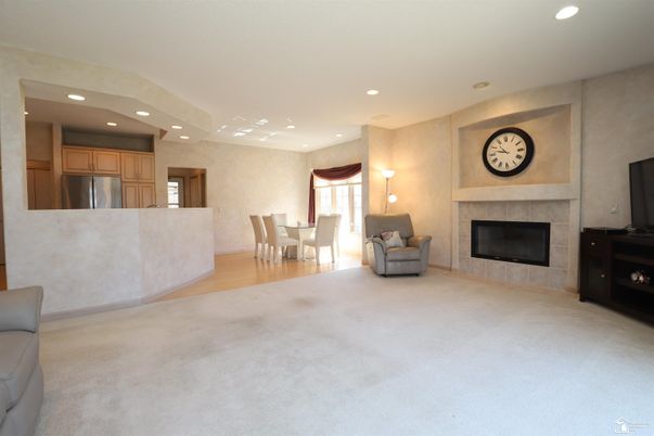 Dining room, Fireplace, Interior, Kitchen, Recessed Lighting, Stainless Steel Appliances, Wood Texture Flooring