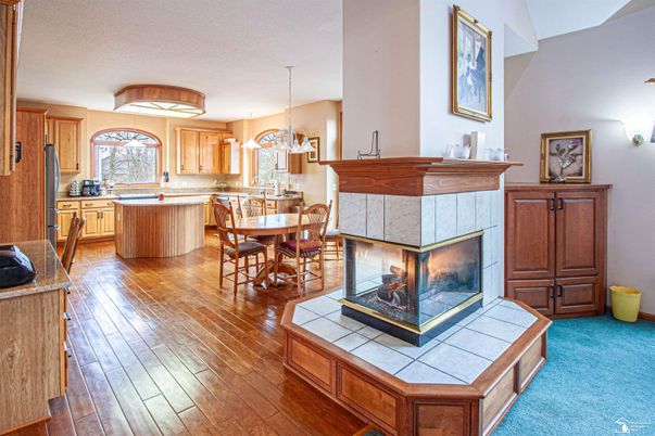 Chandelier, Dining room, Fireplace, Interior, Kitchen, Pendant Lights, Wood Texture Flooring