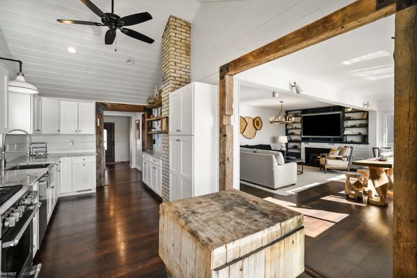 Chandelier, Fireplace, Interior, Kitchen, Living room, Pendant Lights, Recessed Lighting, Wood Texture Flooring