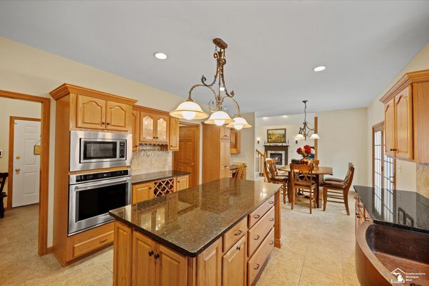Chandelier, Dining room, Fireplace, Interior, Kitchen, Pendant Lights, Recessed Lighting, Stainless Steel Appliances