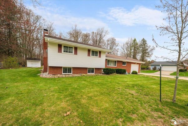 Attached, Backyard, Exterior, Facade, Brick Facade, Split Level