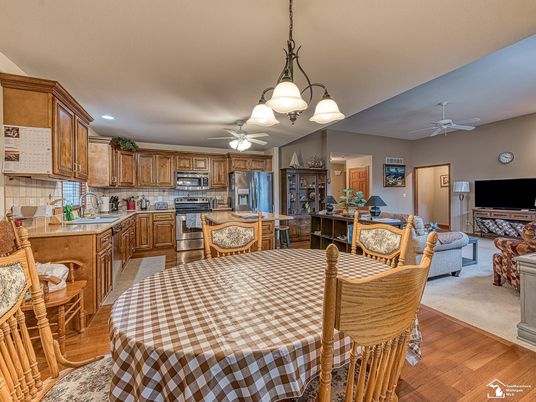Chandelier, Dining room, Interior, Kitchen, Living room, Recessed Lighting, Stainless Steel Appliances, Wood Texture Flooring
