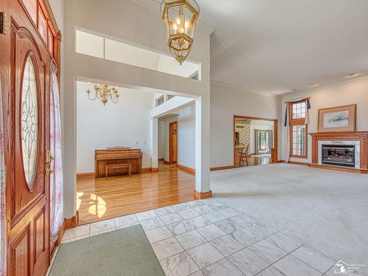 Chandelier, Fireplace, Interior, Marble, Recessed Lighting, Wood Texture Flooring