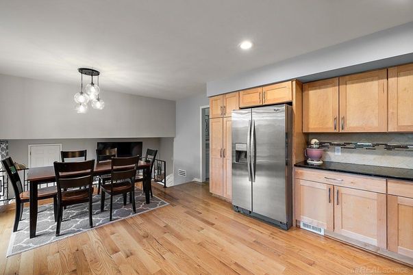 Dining room, Interior, Kitchen, Pendant Lights, Recessed Lighting, Stainless Steel Appliances, Wood Texture Flooring