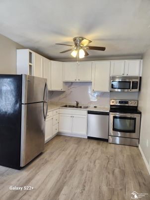 Interior, Kitchen, Marble Walls, Stainless Steel Appliances, Wood Texture Flooring