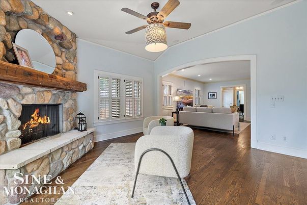 Fireplace, Interior, Living room, Recessed Lighting, Stone Walls, Wood Texture Flooring