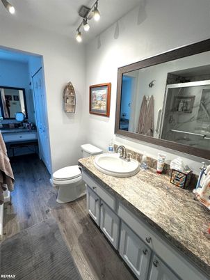 Bathroom, Dual Sink Vanities, Interior, Recessed Lighting, Wood Texture Flooring