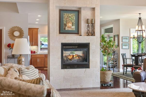 Chandelier, Dining room, Fireplace, Interior, Pendant Lights, Recessed Lighting, Stone Walls, Wood Texture Flooring