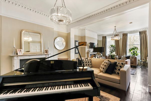Chandelier, Dining room, Fireplace, Interior, Living room, Pendant Lights, Piano, Wood Texture Flooring