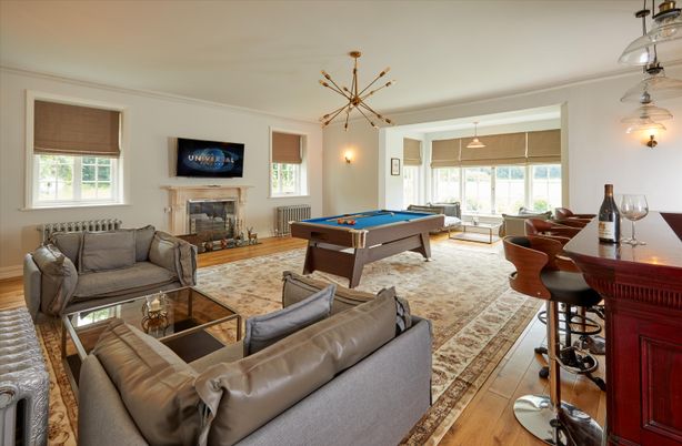Billiard Table, Fireplace, Game Room, Interior, Living room, Pendant Lights, Wood Texture Flooring