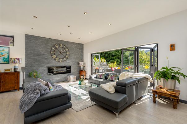 Fireplace, Interior, Living room, Recessed Lighting, Stone Walls, Wood Texture Flooring