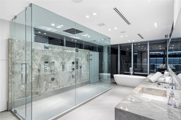 Bathroom, Dual Sink Vanities, Free Standing Baths, Glass Shower, Interior, Marble Walls, Recessed Lighting