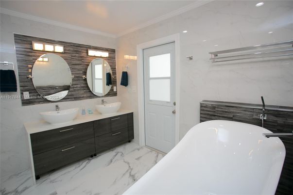 Bathroom, Dual Sink Vanities, Free Standing Baths, Interior, Marble, Marble Walls, Recessed Lighting