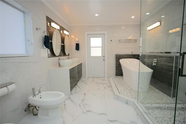 Bathroom, Dual Sink Vanities, Free Standing Baths, Glass Shower, Interior, Marble, Marble Walls, Recessed Lighting