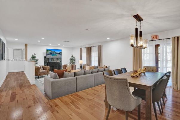 Dining room, Fireplace, Interior, Living room, Pendant Lights, Recessed Lighting, Wood Texture Flooring