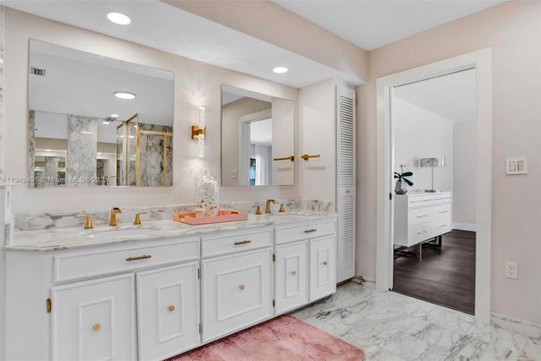 Bathroom, Dual Sink Vanities, Interior, Marble, Recessed Lighting, Wood Texture Flooring