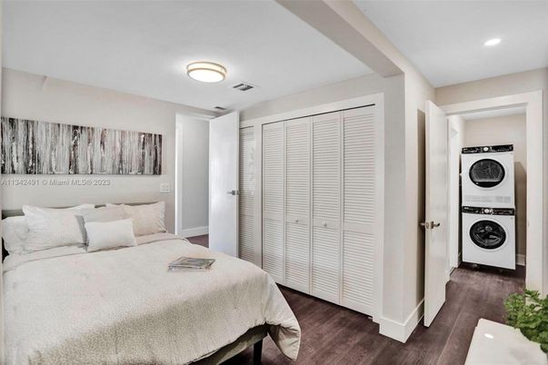 Bedroom, Interior, Recessed Lighting, Utility Closets, Washer, Wood Texture Flooring