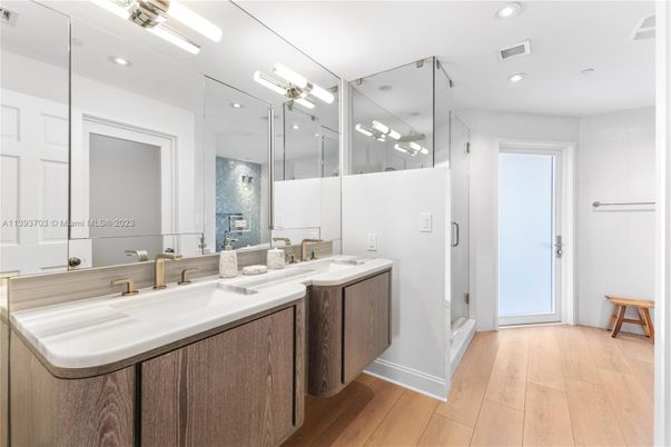 Bathroom, Dual Sink Vanities, Glass Shower, Interior, Recessed Lighting, Wood Texture Flooring
