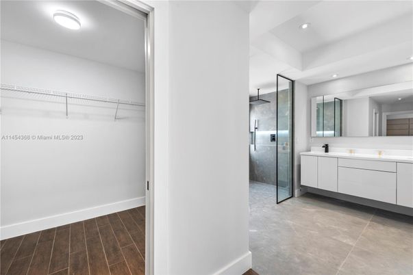 Bathroom, Glass Shower, Interior, Recessed Lighting, Walk-in Closets, Wood Texture Flooring