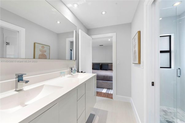 Bathroom, Dual Sink Vanities, Glass Shower, Interior, Recessed Lighting, Wood Texture Flooring