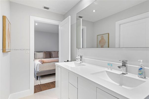 Bathroom, Bedroom, Dual Sink Vanities, Interior, Recessed Lighting, Wood Texture Flooring