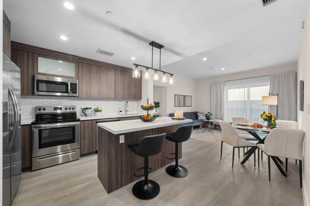 Dining room, Interior, Kitchen, Living room, Pendant Lights, Recessed Lighting, Stainless Steel Appliances, Wood Texture Flooring